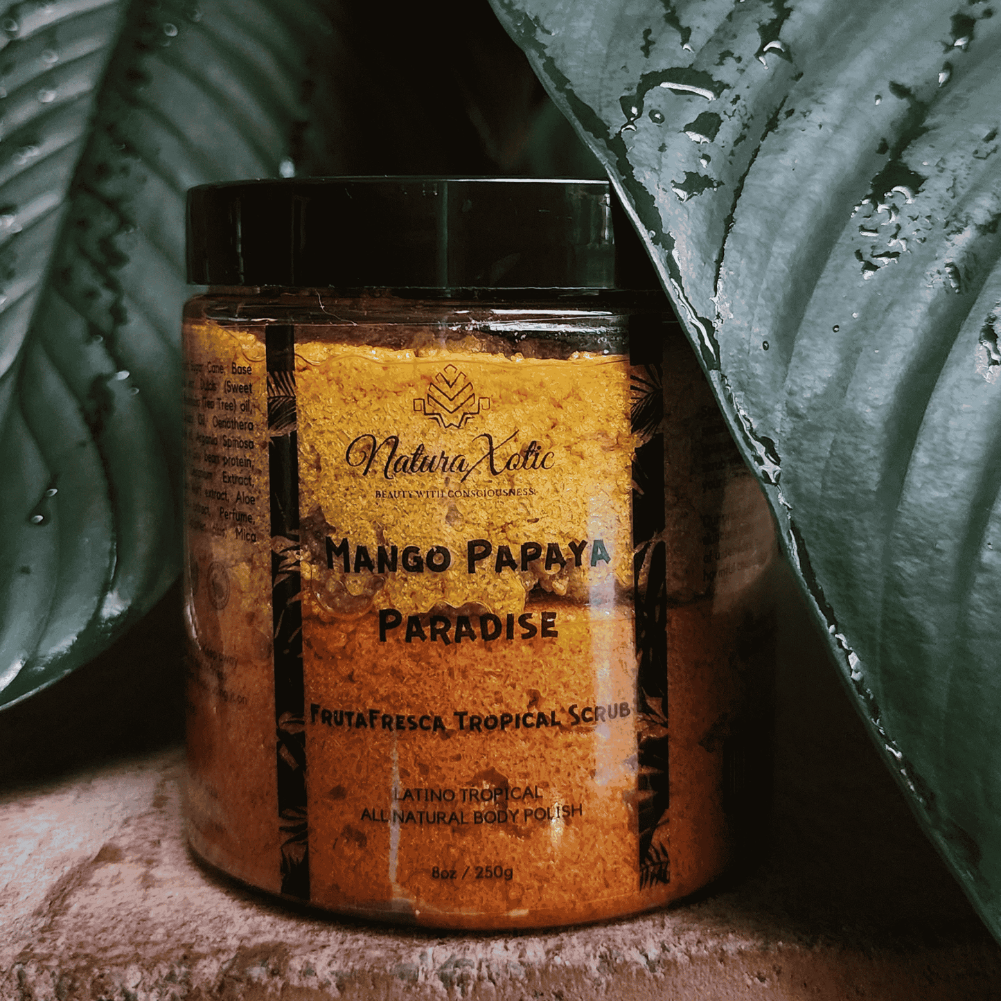 Jar of Mango Papaya Paradise Sugar Scrub with tropical background.